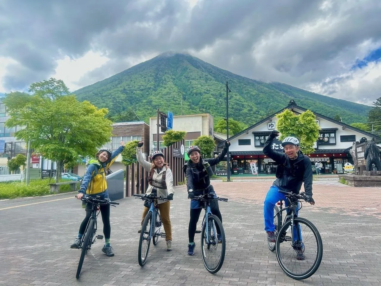 E-bike riders below Mount Nantai at Lake Chuzenji