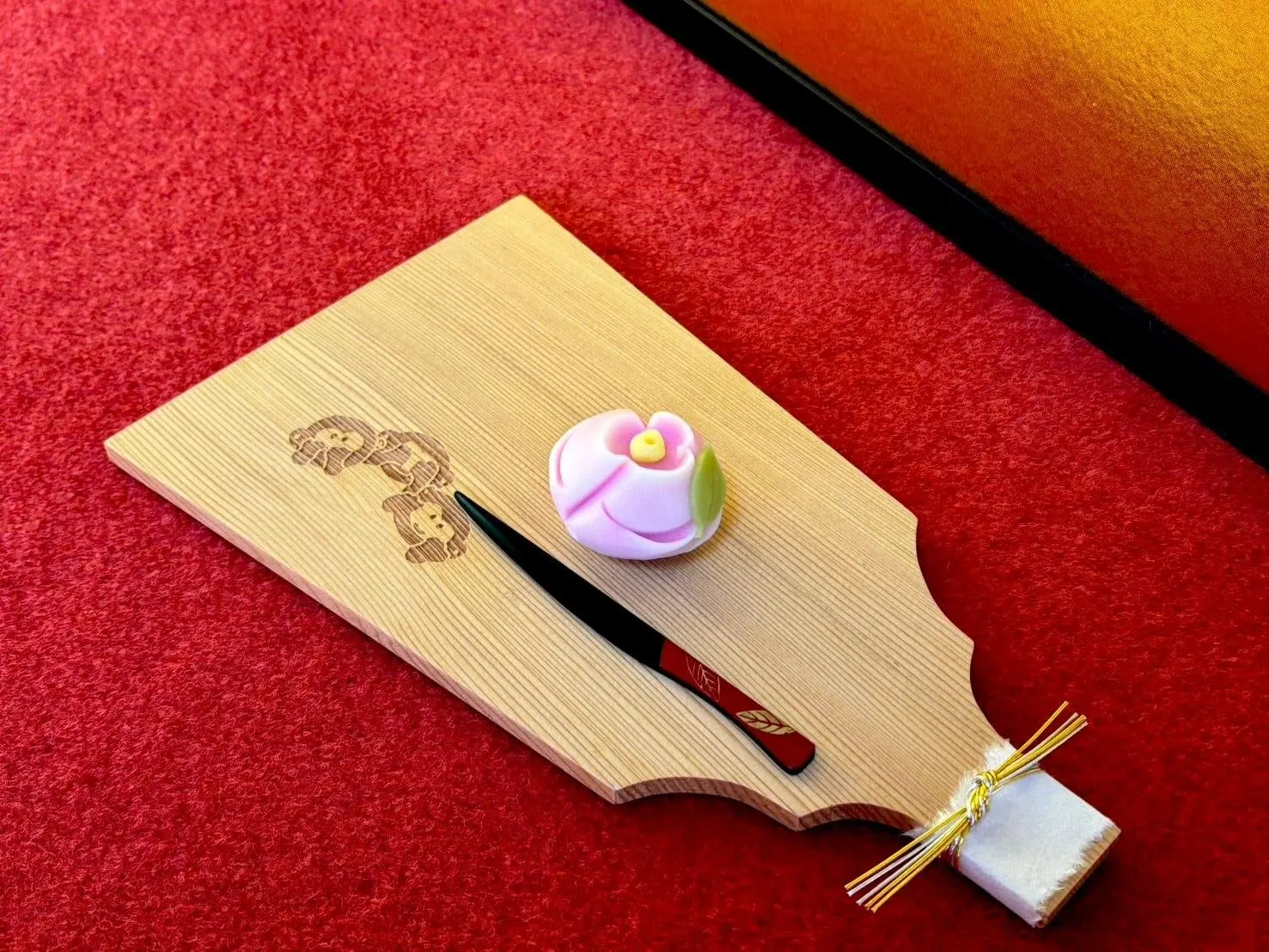A seasonal Japanese sweet on a wooden tray