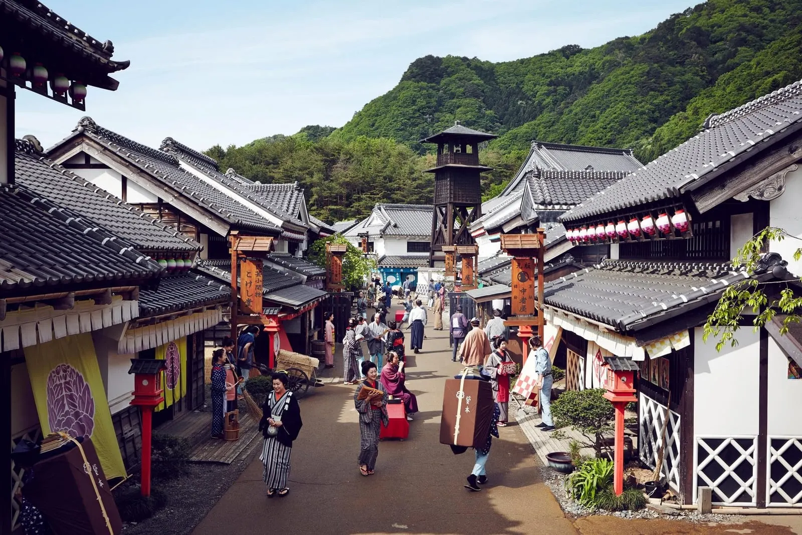 The main street of Edo Wonderland, lined with Edo-period shops and a fire tower