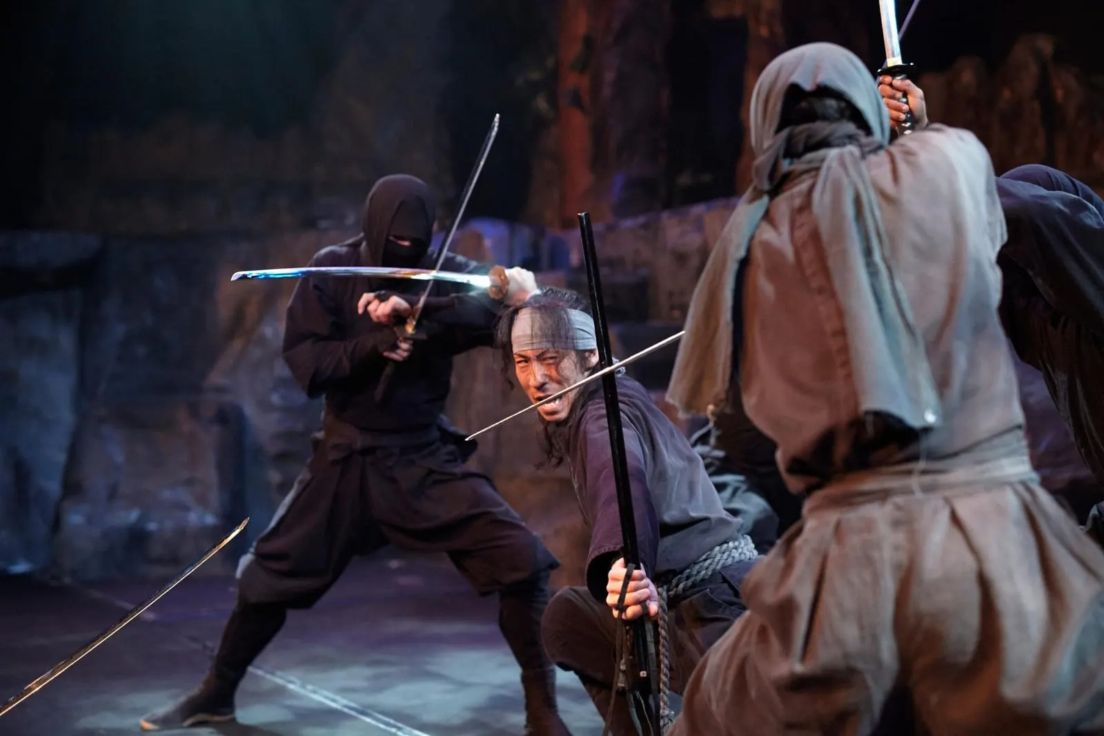 Ninja fighting with swords in the ninja theatre show