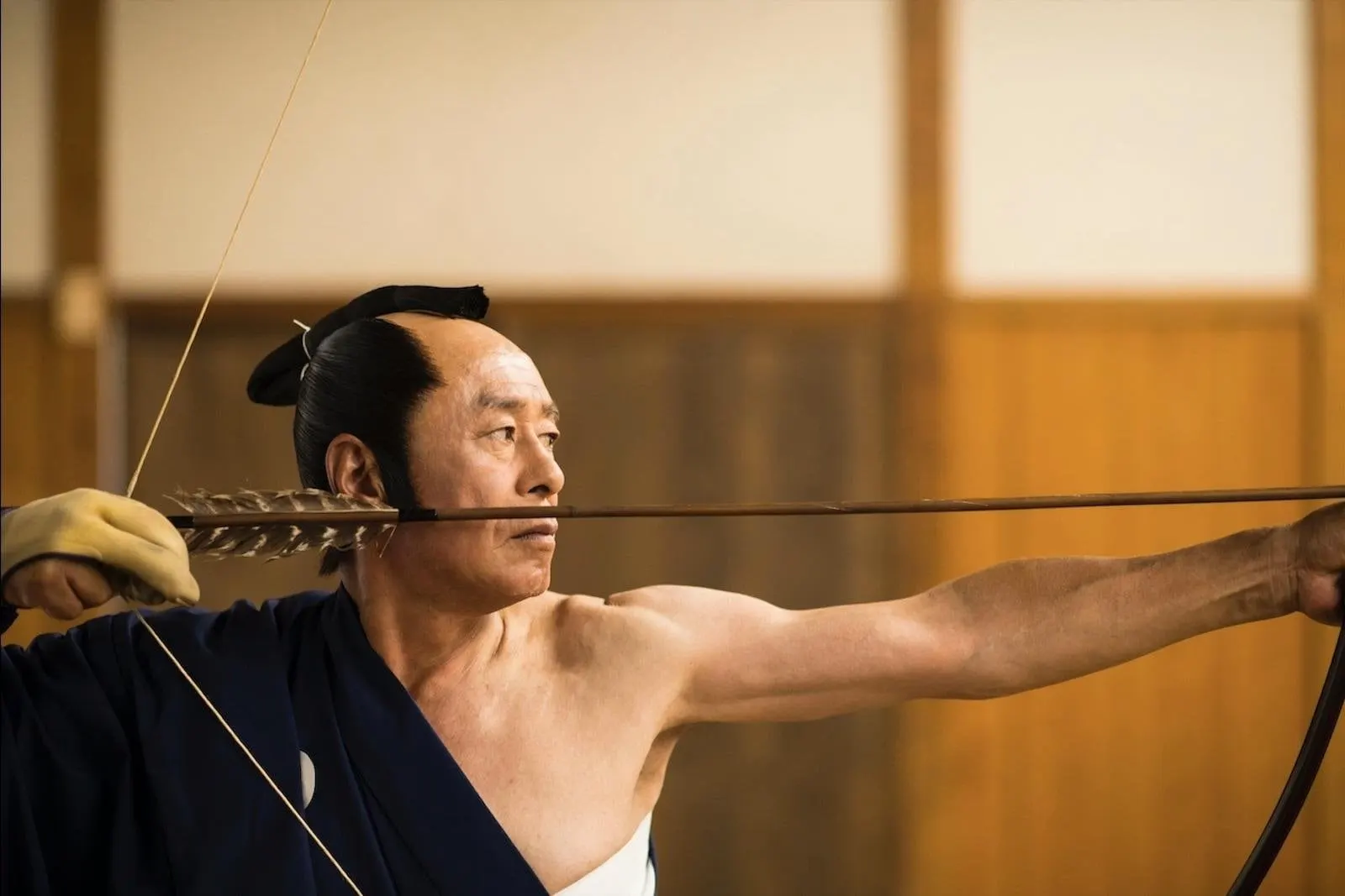 Horseback-archery style bowman drawing a Japanese bow