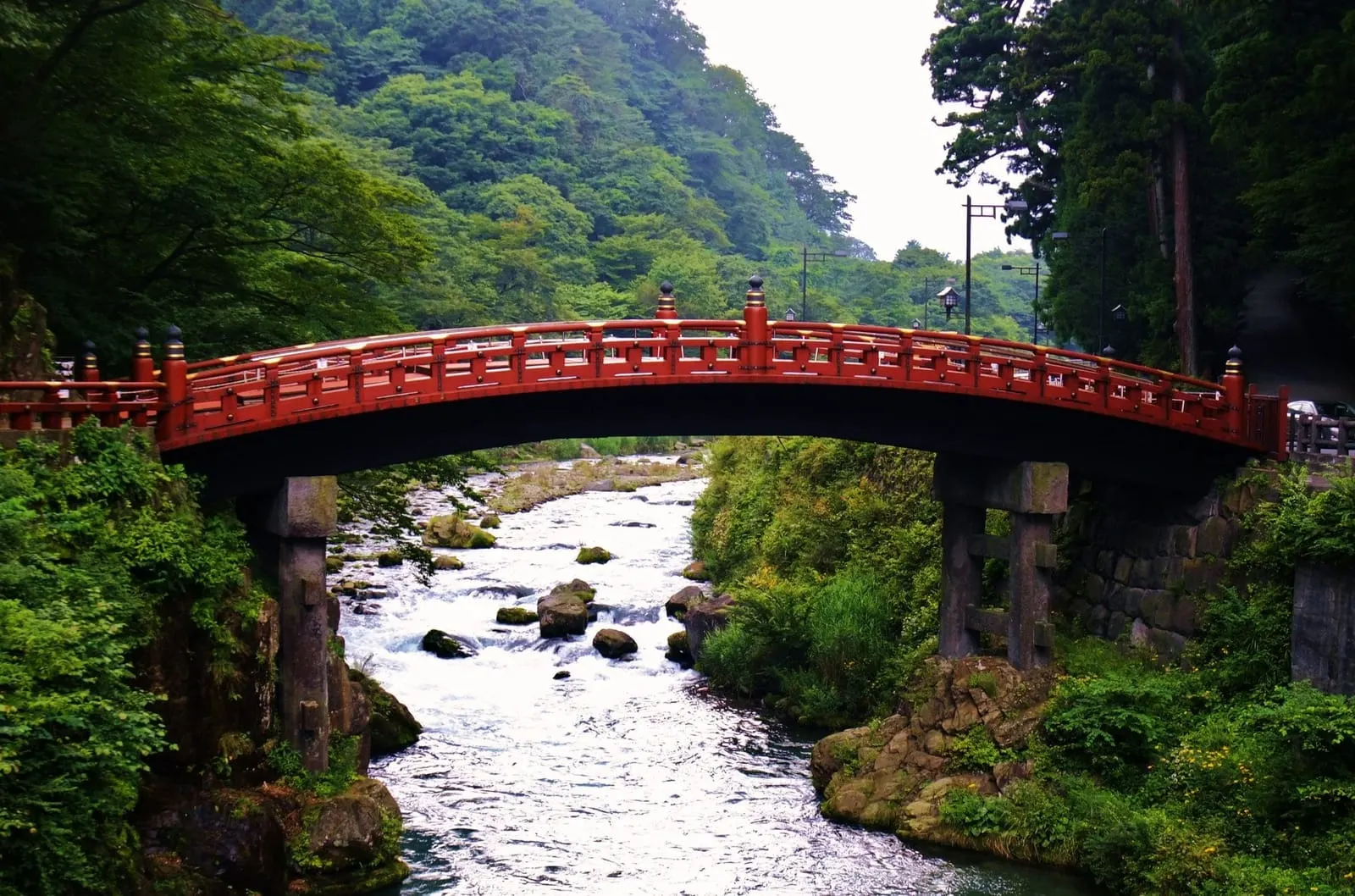 Shinkyo Bridge over the Daiya river in summer green