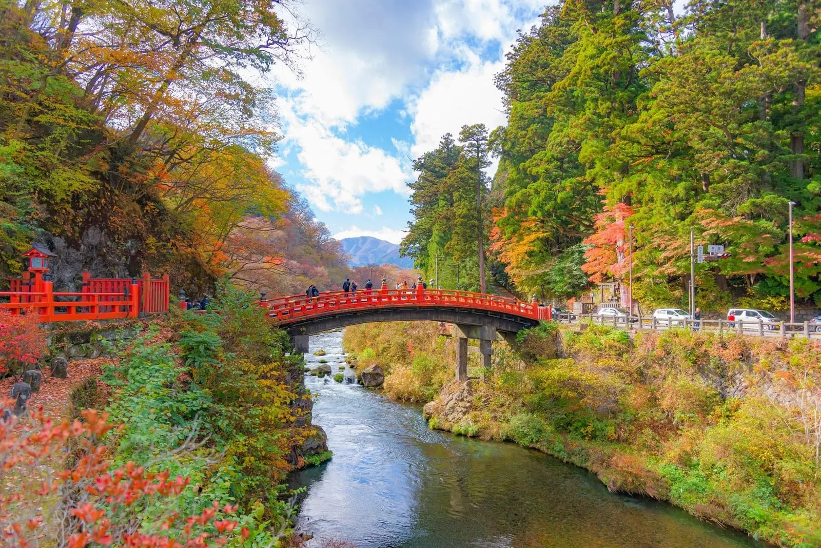 The vermilion Shinkyo Bridge over the Daiya river in autumn colour